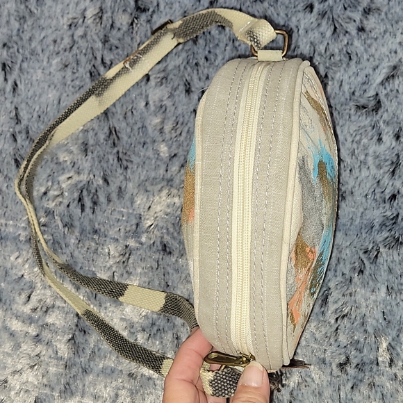 Canvas round crossbody purse. Has splashes of color. - Picture 9 of 10